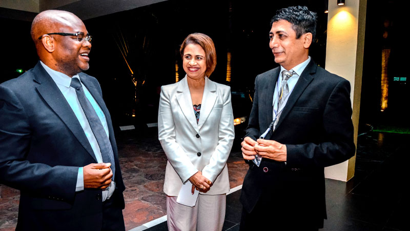 Prof Kitila Mkumbo (L), Minister of State in the President’s Office (Planning Investment, has a quick word with Craft Silicon Group CEO Kamala Budhabhati (R) in Dar es Salaam yesterday. Looking on is the firm’s CEO in Tanzania, Mili Rughani. 