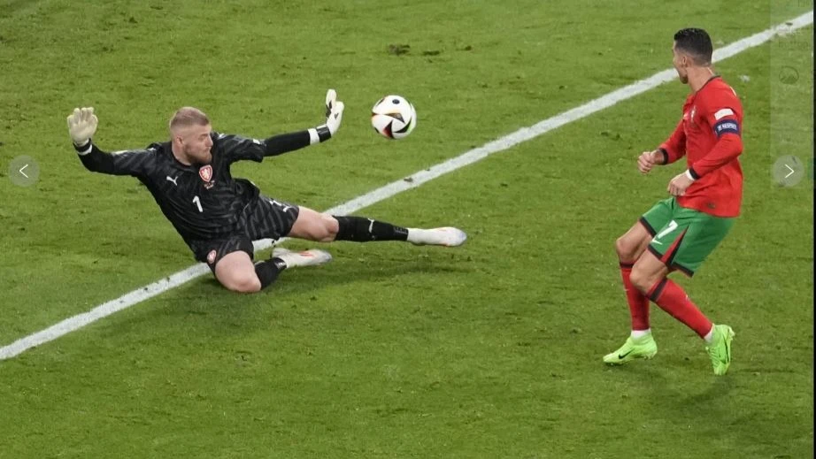 
Czech Republic’s goalkeeper JindrichStanek (1) stops a shot by Portugal’s Cristiano Ronaldo during their Group F match at the Euro 2024 soccer tournament in Leipzig, Germany, Tuesday, June 18, 2024.