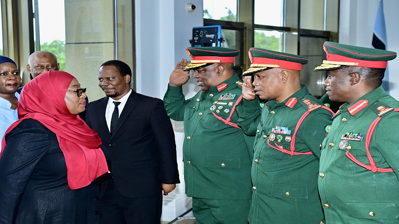 President Samia Suluhu Hassan greets the Tanzania People's Defence Forces (TPDF), Chief of Staff Lieutenant General Salim Haji Othman (3rd R) and Major General Marco Gaguti (2nd R), after arriving at the National Defence College (NDC) Kunduchi, DSM.