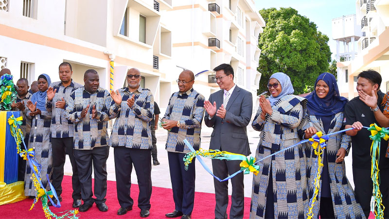 Zanzibar President Dr Hussein Ali Mwinyi cuts the ribbon in South Pemba Region yesterday to launch Abdulla Mzee Hospital doctors’ residential quarters. 
