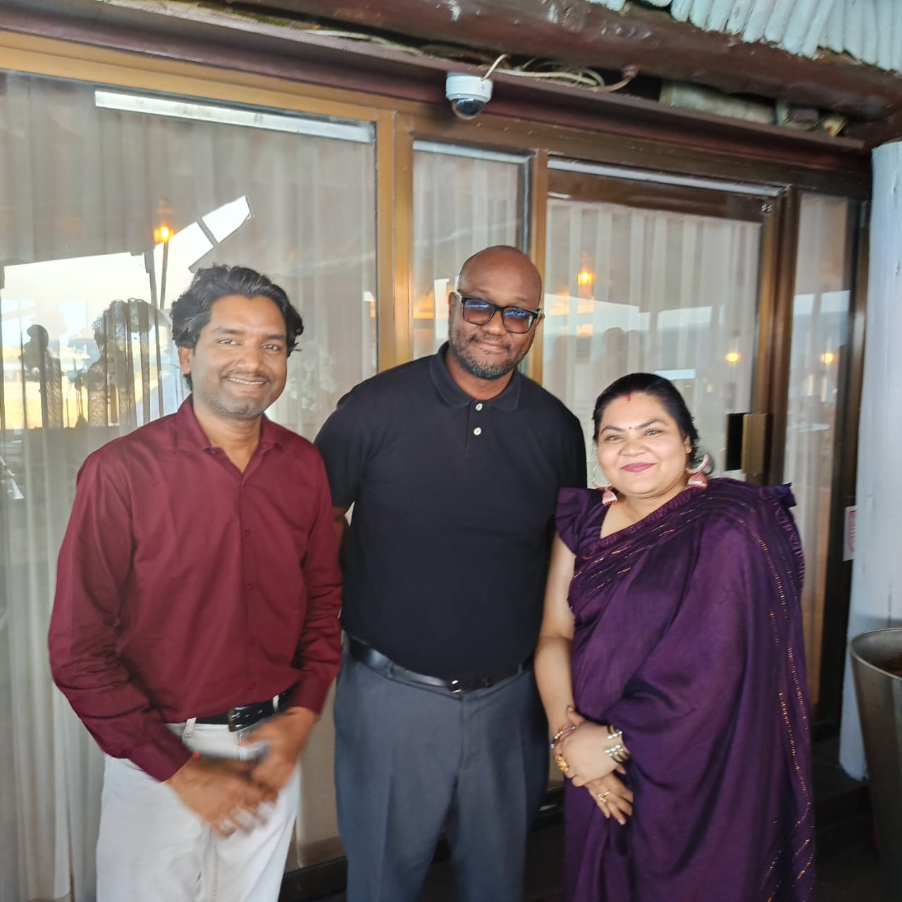 6.	IPP Executive Chairman Abdiel Mengi poses in a group photo with former TGL Guardian Ltd commercial director Ajay Goyal (L) and his wife 