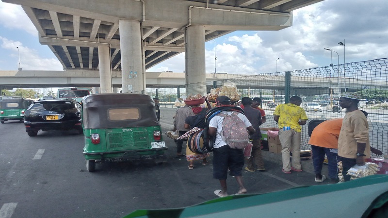 Small traders wait for potential customers under the Ubungo interchange flyover in Dar es Salaam yesterday even as business is not allowed at the spot. 