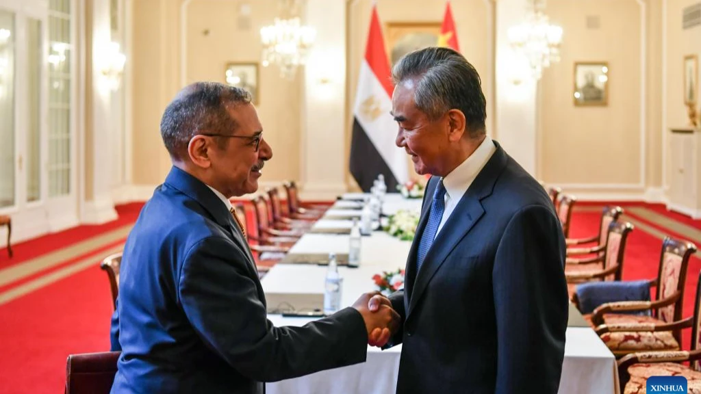 Wang Yi, a member of the Political Bureau of the Communist Party of China Central Committee and director of the Office of the Central Commission for Foreign Affairs, meets with Youssef Alaa El-Deen, secretary general of the Egyptian National Security