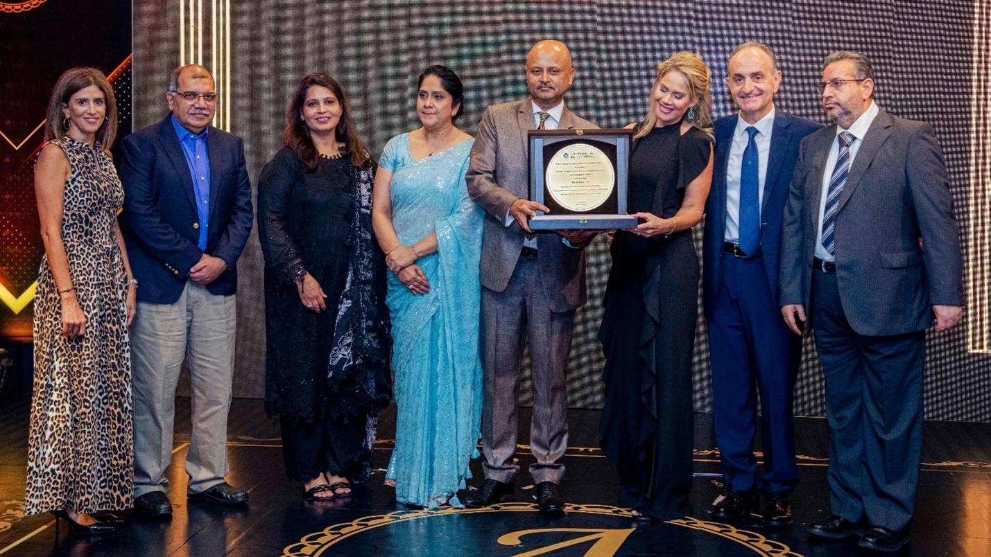 SBC Tanzania Ltd staff at a farewell gala in honour of departing CEO and Director Avinash Jha (center), presented by Ziad El Khalil, the Executive Director of SBC Tanzania Ltd (second right) held in Dar Es Salaam over the weekend.