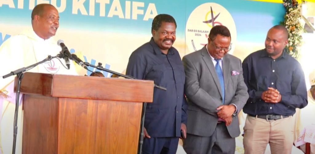 Tanzania Episcopal Conference Secretary General, Father Dr Charles Kitima (L) introduces ruling CCM Secretary General Dr Emmanuel Nchimbi (2nd-L), opposition Chadema Vice Chairman (Mainland) Tundu Lissu (2nd-R) at Tanz's 5th National Eucharist Congress