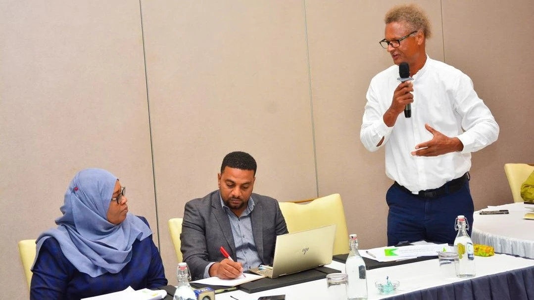 Caption: TATO Chairman Wilbard Chambulo (standing with microphone) explains about the stakeholders concerns during the consultative meeting with Zanzibar’s Finance Minister Dr Saada Mkuya (L)