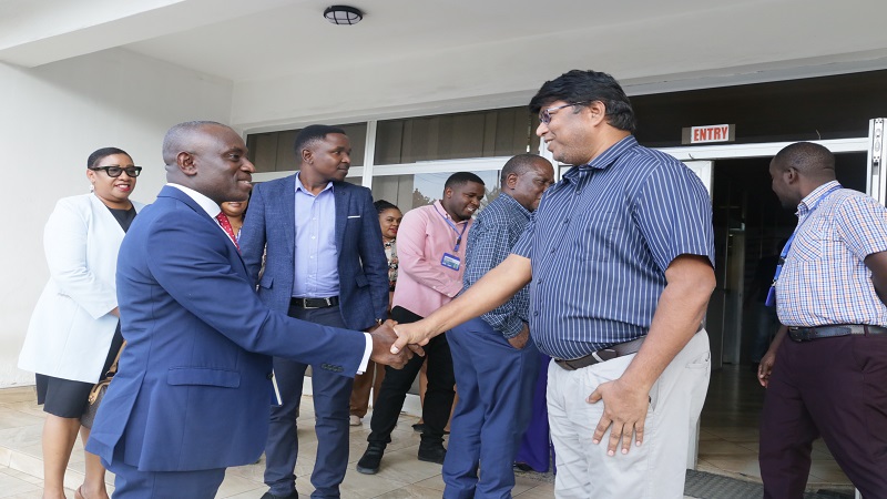 The Guardian Ltd printing manager Balasubramanian Venkadachalam exchanges greetings with the Ecobank MD