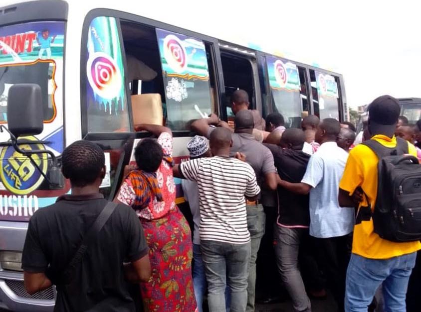 It’s survival of the fittest par excellence as would-be passengers scramble for space in a commuter bus at Dar es Salaam’s Mbezi Luis bus stop yesterday. 