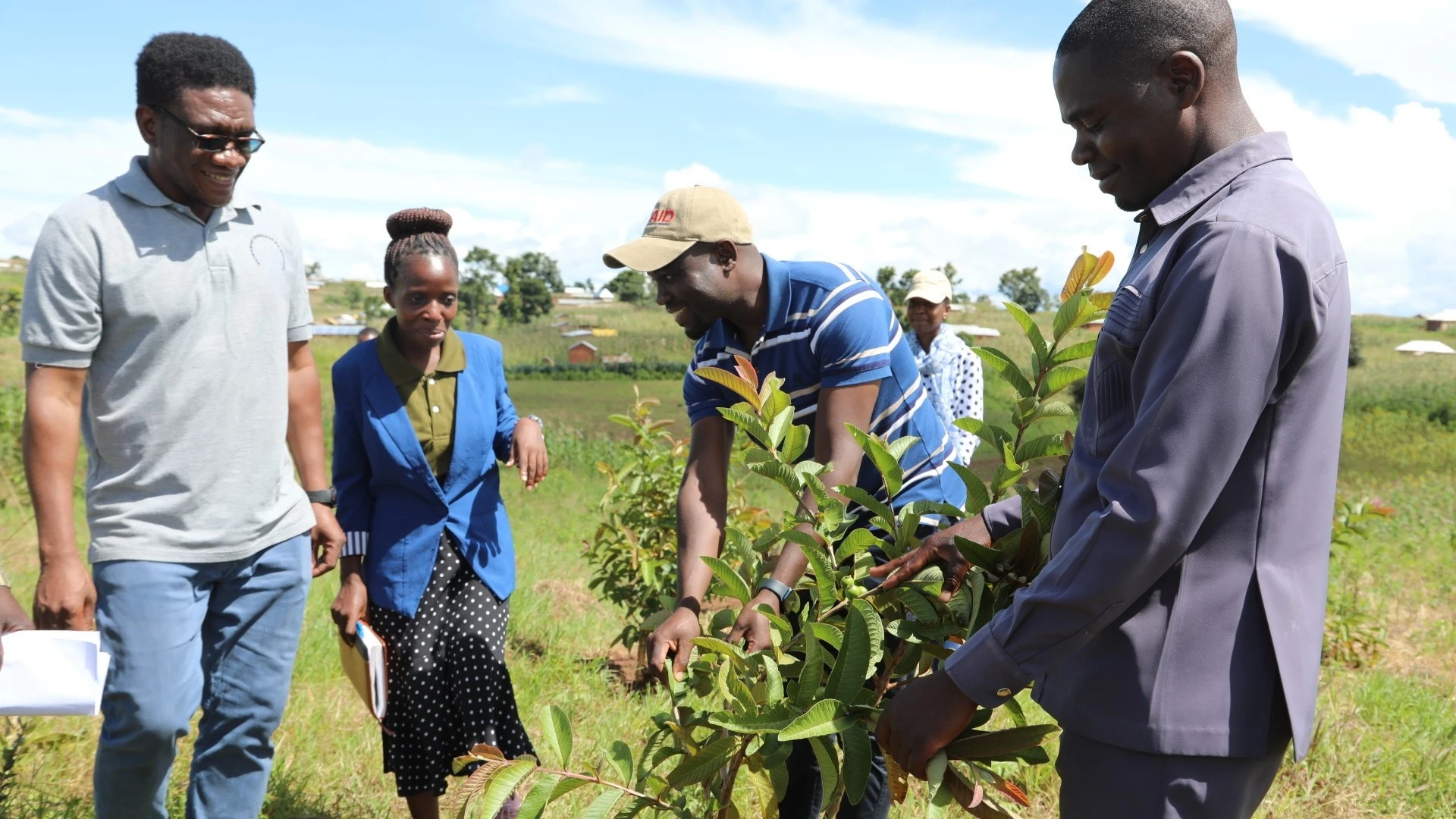 Tracking conservation of the environment: officials from USAID, LEAT and Malongwe village in Nkasi District Council in Rukwa region examine tree seedlings planted in the village as part of the efforts to conserve and protect the environment.

 