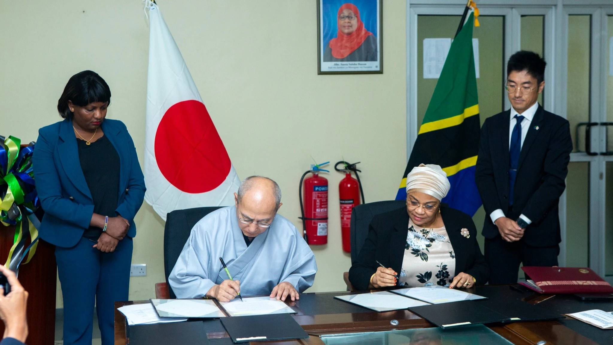 Finance ministry permanent secretary Dr Natu El-Maamry Mwamba (R) and Japan’s Ambassador to Tanzania, Yasushi Misawa, pictured in Dar es Salaam yesterday signing documents relating to an agreement on 68.5bn/- donated by JICA