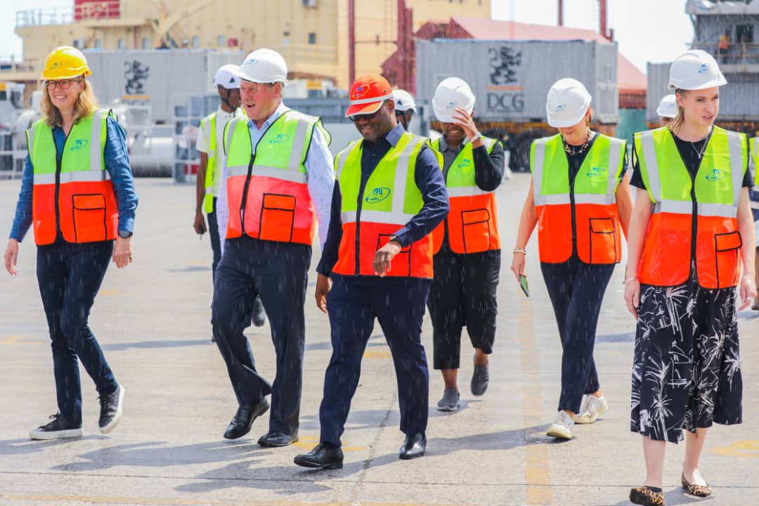 Dar es Salaam Port’s acting director, Abed Gallus Abed (3rd-L), takes a delegation of visitors from a German vehicle manufacturing giant around the facility earlier this week