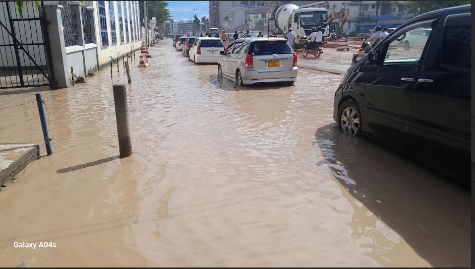 A flood-prone stretch of Dar es Salaam’s Bibi Titi Road is rendered temporarily impassable yesterday following a downpour, with access to the nearby Dar es Salaam Institute of Technology all but blocked. 