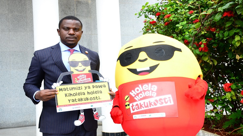 Works minister Innocent Bashungwa pictured with mascot KIDO, “ambassador” of the USAID-funded Antimicrobial Resistance awareness campaign at the National Assembly grounds in Dodoma city 