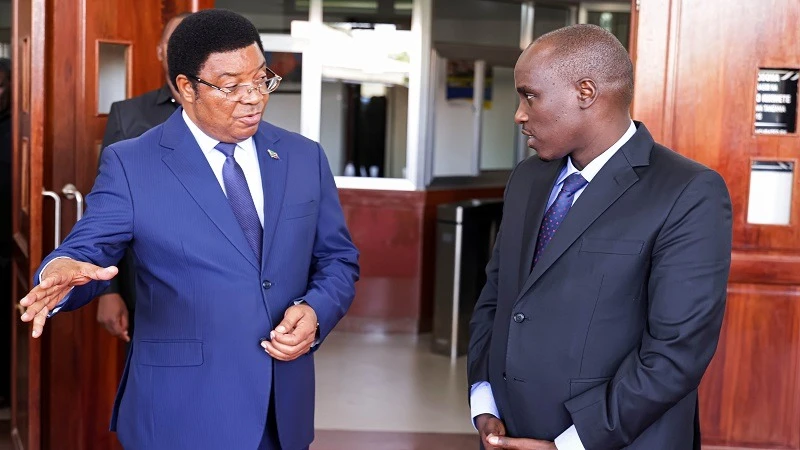 Prime Minister Kassim Majaliwa and Deputy Prime Minister and Energy minister Dr Doto Biteko (R) consult in Dodoma city yesterday moments after a working meeting for ministers and deputy ministers on the use of the electronic Cabinet system (e-CABINET. 