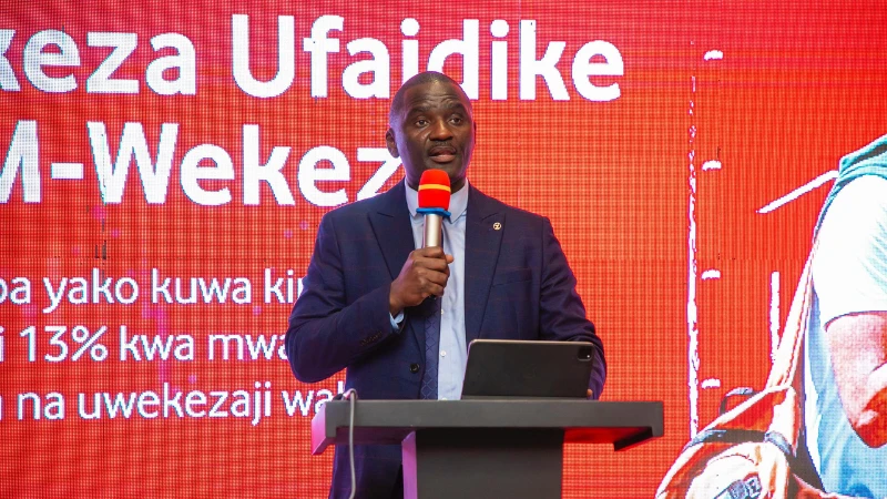 Managing Director of M-Pesa Tanzania, Epimack Mbeteni, speaking at the launch of M-wekeza service by Vodacom in collaboration with Sanlam Investment recently in Dar es Salaam.