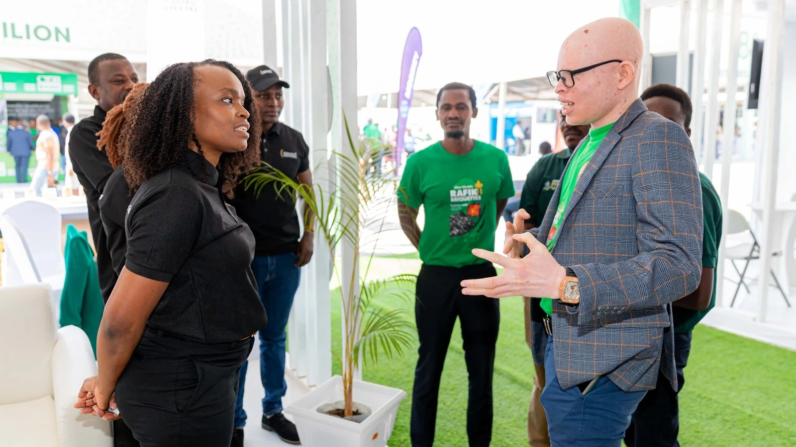 SBL's Communications and Sustainability Manager, Rispa Hatibu, engaging in a discussion with the Chairman of the Foundation for Disabilities Hope, Michael Salali, during the Nane Nane exhibition held in Dodoma region this year.