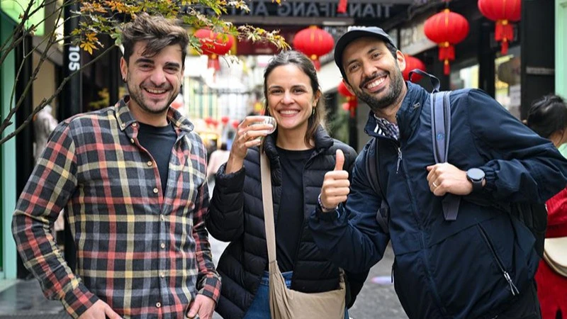 Tourists from Spain visit Tianzifang, an art area in east China’s Shanghai, Dec. 3, 2024. Expanding visa-free policy is a milestone in China’s journey toward greater openness and also shows its confidence on the global stage. 