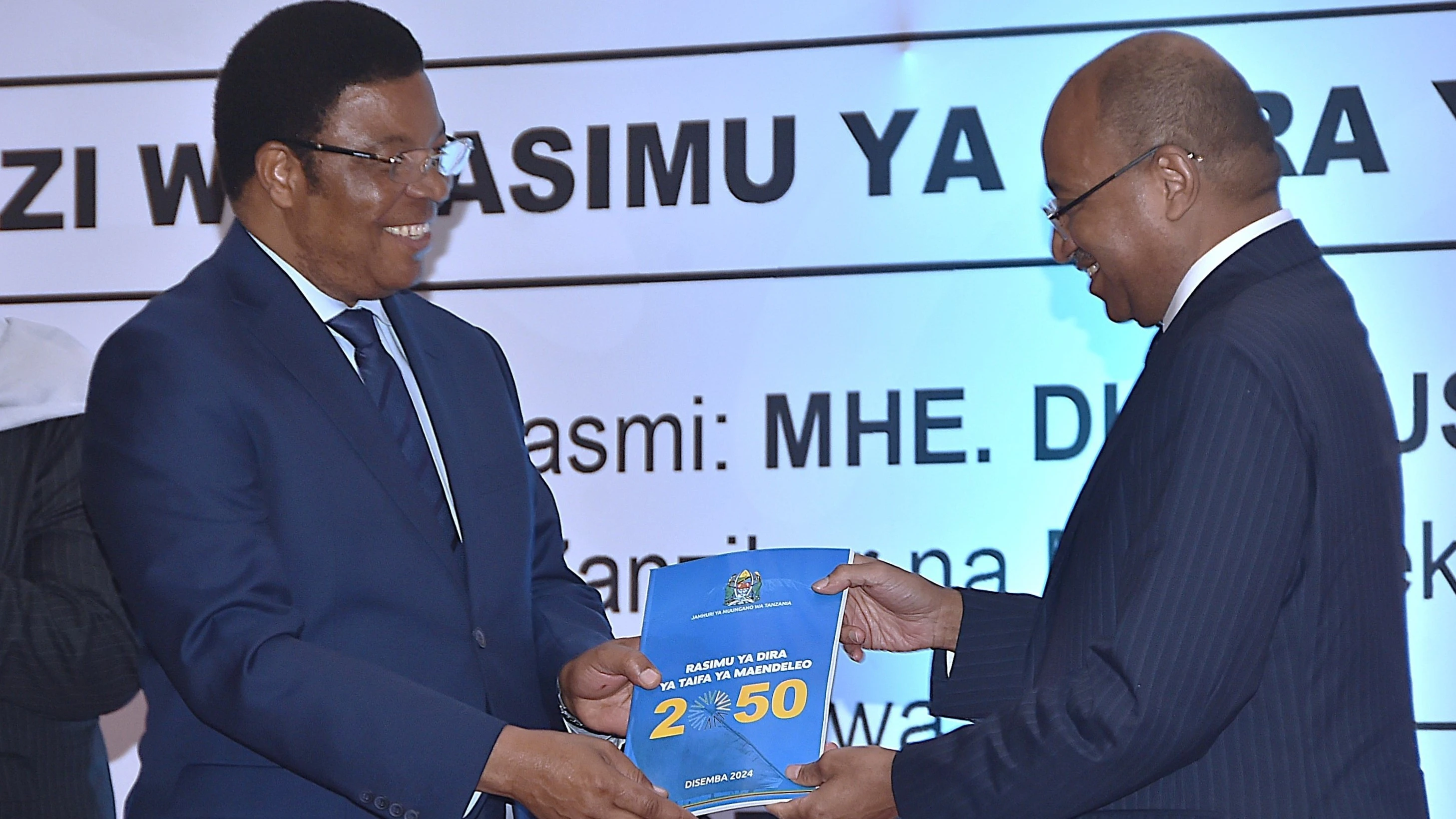 Zanzibar President Dr Hussein Ali Mwinyi presents a draft of Tanzania's National Development Vision 2050 to Prime Minister Kassim Majaliwa