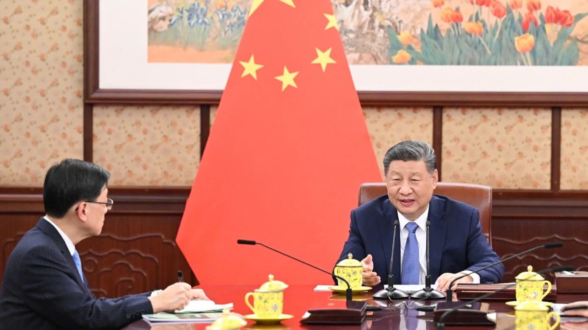 President Xi Jinping meets with Chief Executive of the Hong Kong Special Administrative Region (HKSAR) John Lee Ka-chiu, who is on a duty visit to Beijing, capital of China, Dec 13, 2024.