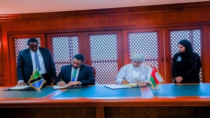 Finance minister Dr Mwigulu Nchemba (2nd-L) signs an agreement in Muscat yesterday with the chairman of the Sultanate of Oman’s Tax Authority, Nasser Al-Jashmi, on the mutual elimination – between Tanzania and Oman