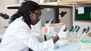 A lab technician testing for malaria 