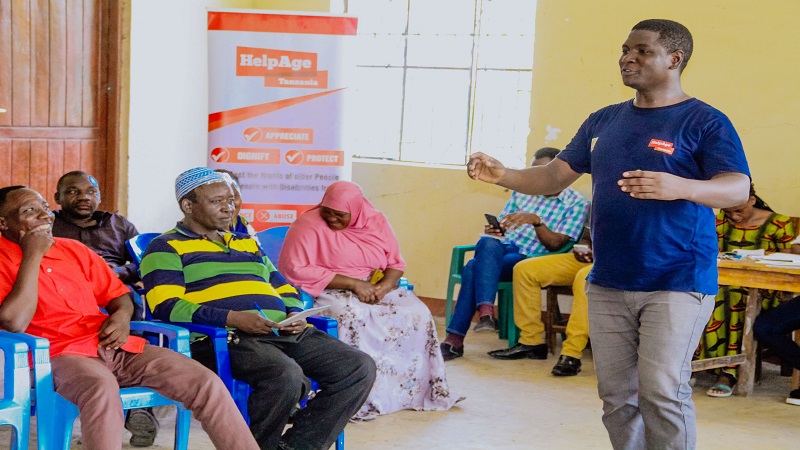 HelpAge Tanzania instructor John Eddy (R) pictured at Mwamalasa in Kishapu District on Friday leading a group discussion on ways to combat gender-based violence.