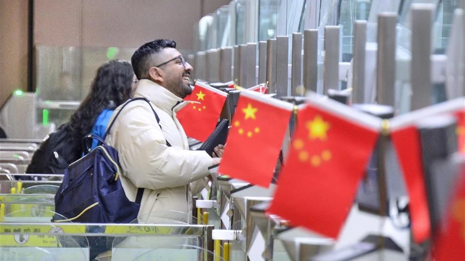 Travelers undergo border inspection at Beijing Daxing International Airport on January 2, 2025.