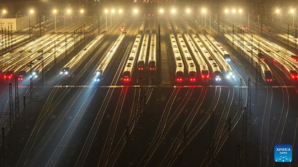 An aerial drone photo taken on Jan. 14, 2025 shows bullet trains waiting for departure at the parking yard of a bullet train depot in Tianjin, north China. The Spring Festival travel rush of this year started on Tuesday and will last till Feb. 22. 