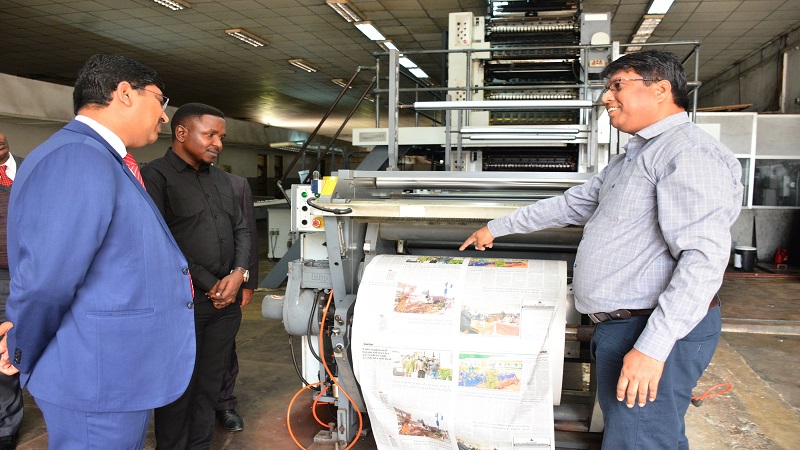 High Commissioner Bishwadip Dey listen information on the TGL's newspapers printing operations from TGL Printing Plant Manager, Balasubramaniyan Venkadachalam (R). Looking on (2nd L) is the TGL Deputy General Manager, Jackson Paul.