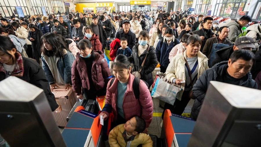 Passengers pass through a ticket barrier at Changsha Railway Station in Changsha, central China's Hunan Province, Jan. 14, 2025.