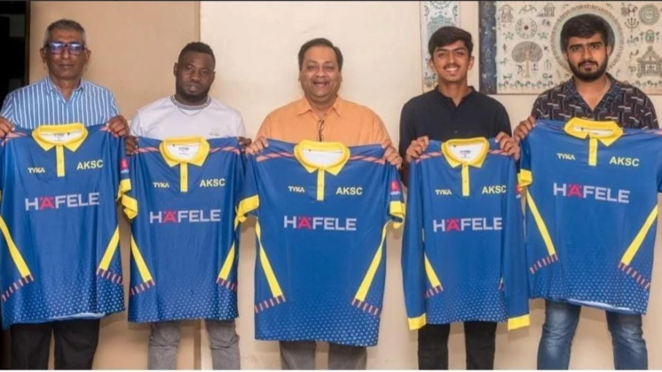 HAFELE East Africa Limited's Managing Director Snehal Bakrania (C) poses for a picture with Aga Khan SC's leader Ayzaz Jassani (L) and the club's players (L-R) Riziki Kiseto, Laksh Bakrania (Team B captain), and Harsheed Chohan 