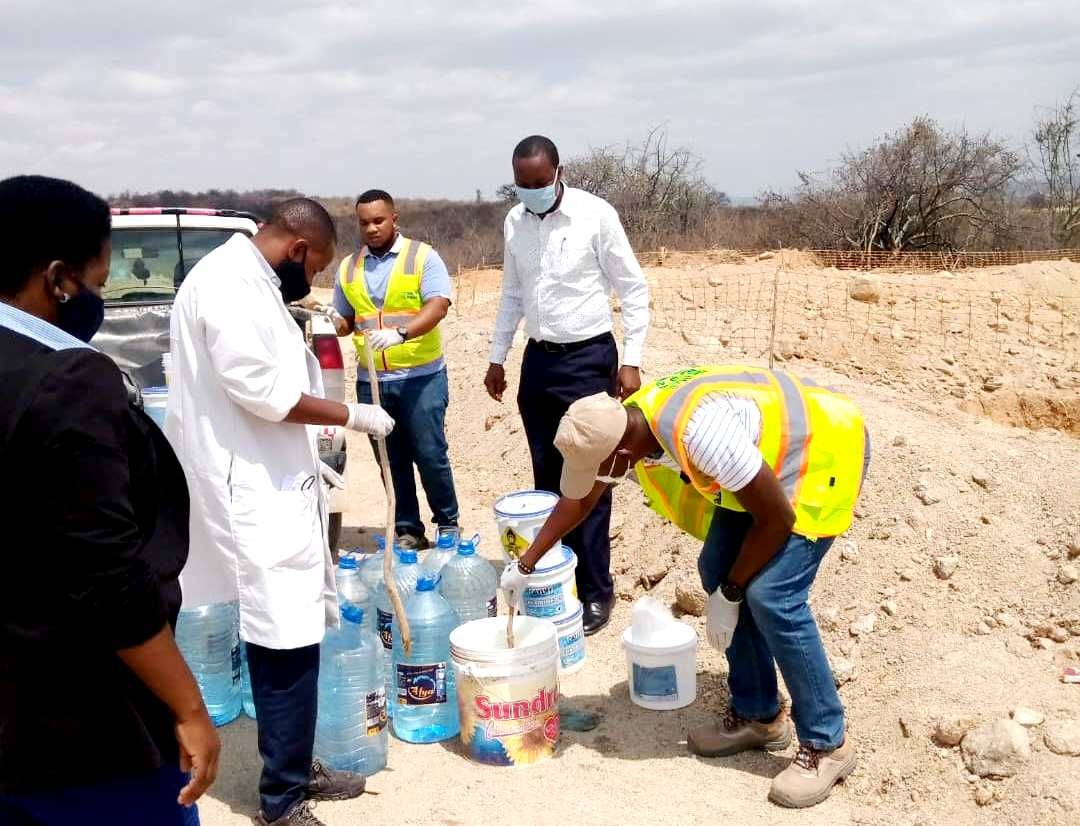 Officials from the National Environment Management Council (NEMC) meas-uring sewage from the sewage pits of the Yapi Merkez Company the contractor building of the Standard Gauge Railway (SGR) in Dodoma yesterday. 