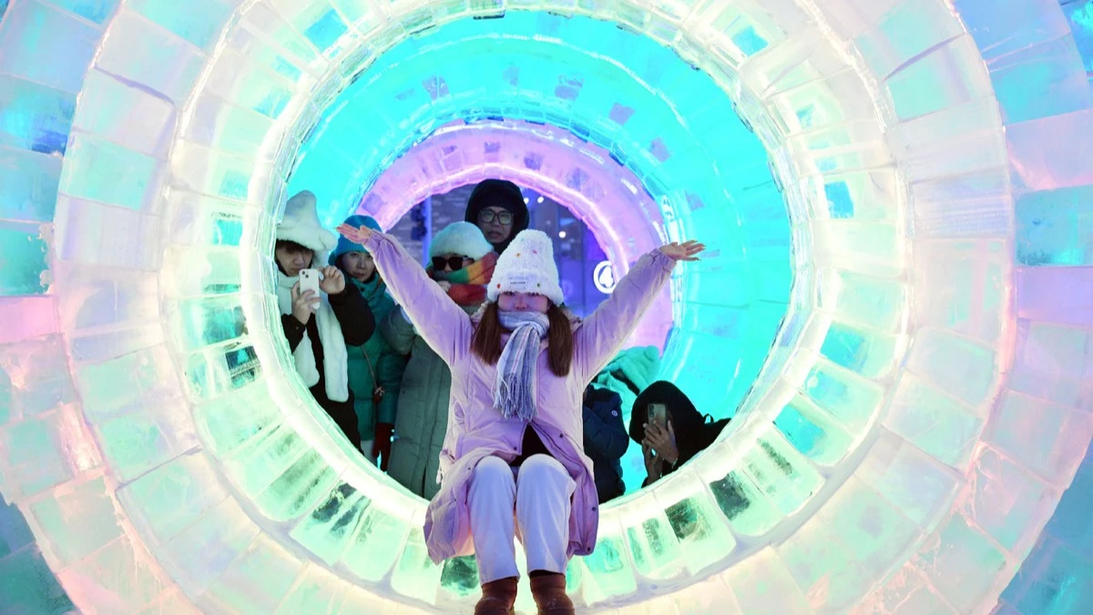 
A visitor poses for photos at the Harbin Ice-Snow World in Harbin, Northeast China's Heilongjiang province, Jan 5, 2025.