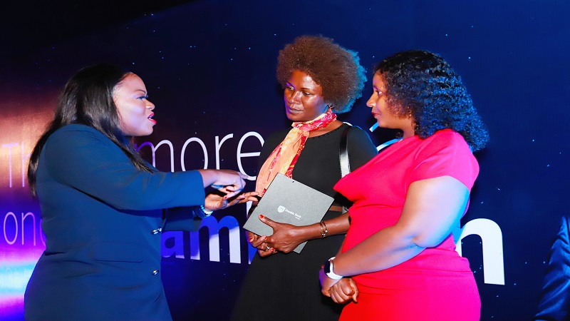 Shangwe Kisanji (L) Head of the Private Banking Division at Stanbic Bank Tanzania, exchanges ideas with two of the bank’s clients in Mwanza Region: Levina Beal (C) and Fatma Kimwaga. It was shortly after yesterday’s launch of a drive