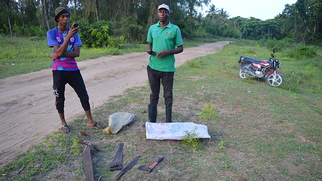 Khamis Ali Khamis  (right) acting chief-in-charge of 2,900-hectare (7,200-acre) reserve. Leading a small team of forest guards, he has the difficult job of protecting the reserve from illegal activity, while also balancing the needs 