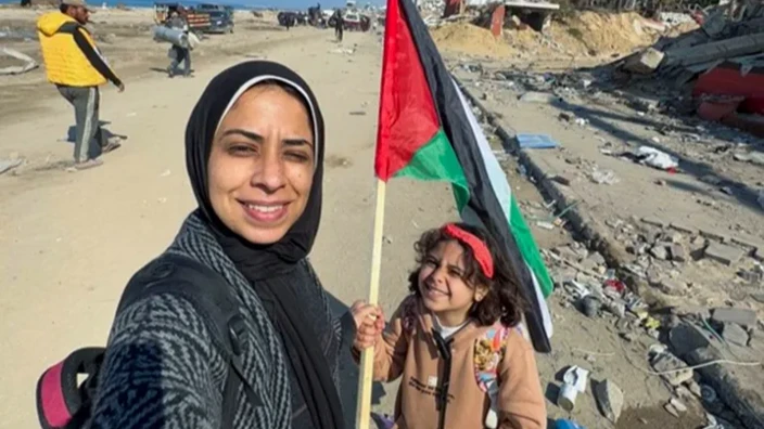 Maram Humaid and her daughter Banias as they arrived in northern Gaza after being displaced in the south