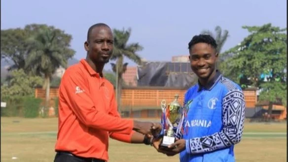 
Tanzania's U-19 men's cricket squad's Mohamed Simba (R) gets the Player of the Match prize from the match umpire when the side confronted the Uganda U-19 squad in the 2025 Easter Youth ODI Series clash in Kampala last Sunday.