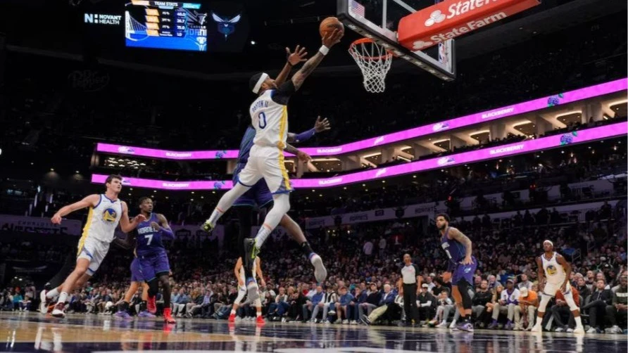 Golden State Warriors guard Gary Payton II (0) goes to the basket against Charlotte Hornets center Mark Williams (5) during the second quarter at Spectrum Center in Charlotte, North Carolina, USA on Monday. 