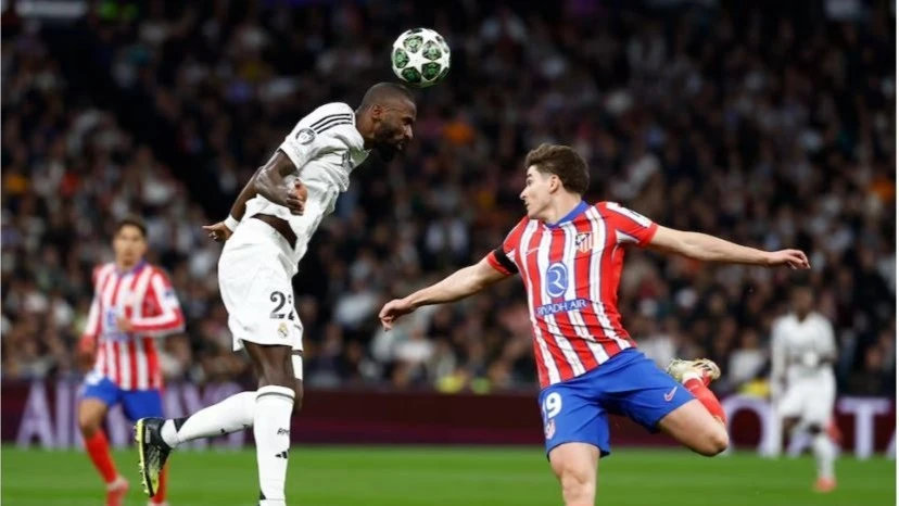 Real Madrid's Antonio Rudiger in action with Atletico Madrid's Julian Alvarez during their Champions League - Round of 16 - First Leg match at Santiago Bernabeu, in Madrid, Spain on Tuesday.