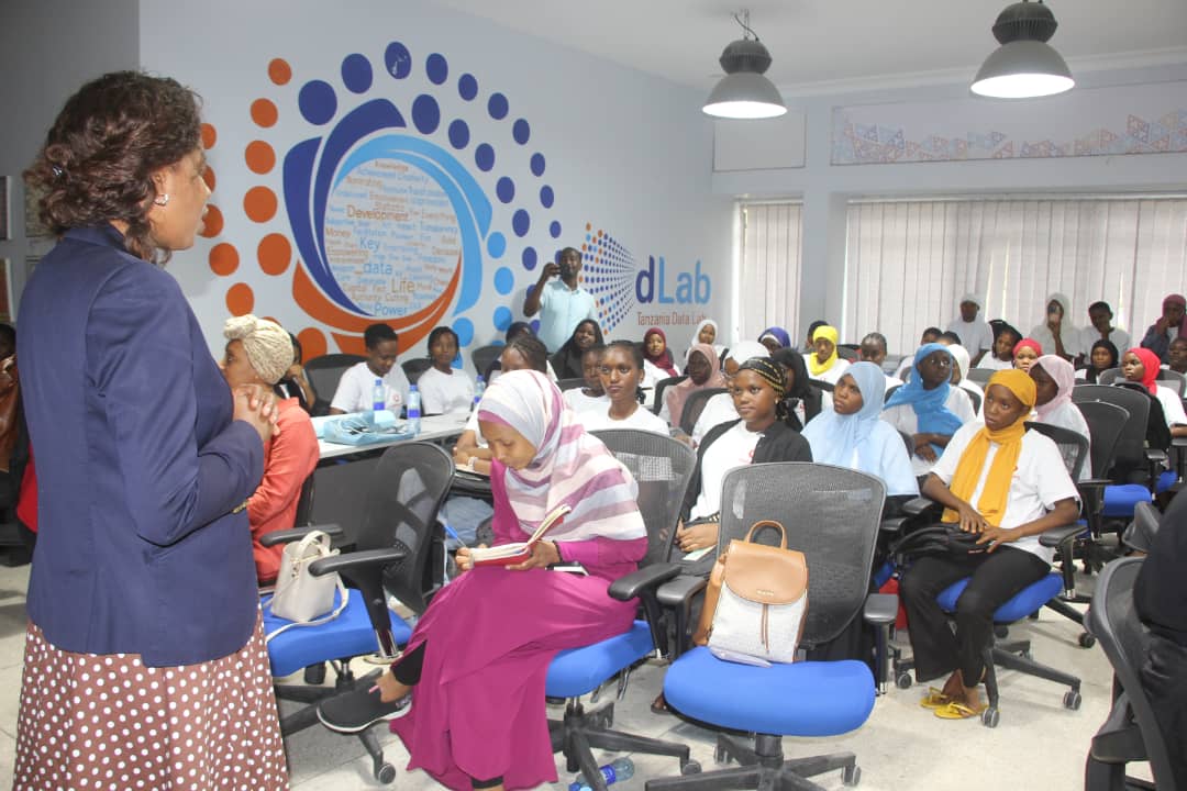 Vodacom Tanzania PLC's HR Director, Vivienne Penessis (left), engages with students from the Code Like A Girl program, an initiative by Vodacom Tanzania and dLab to equip young girls with STEM skills. The event was held Friday in Dar es Salaam.