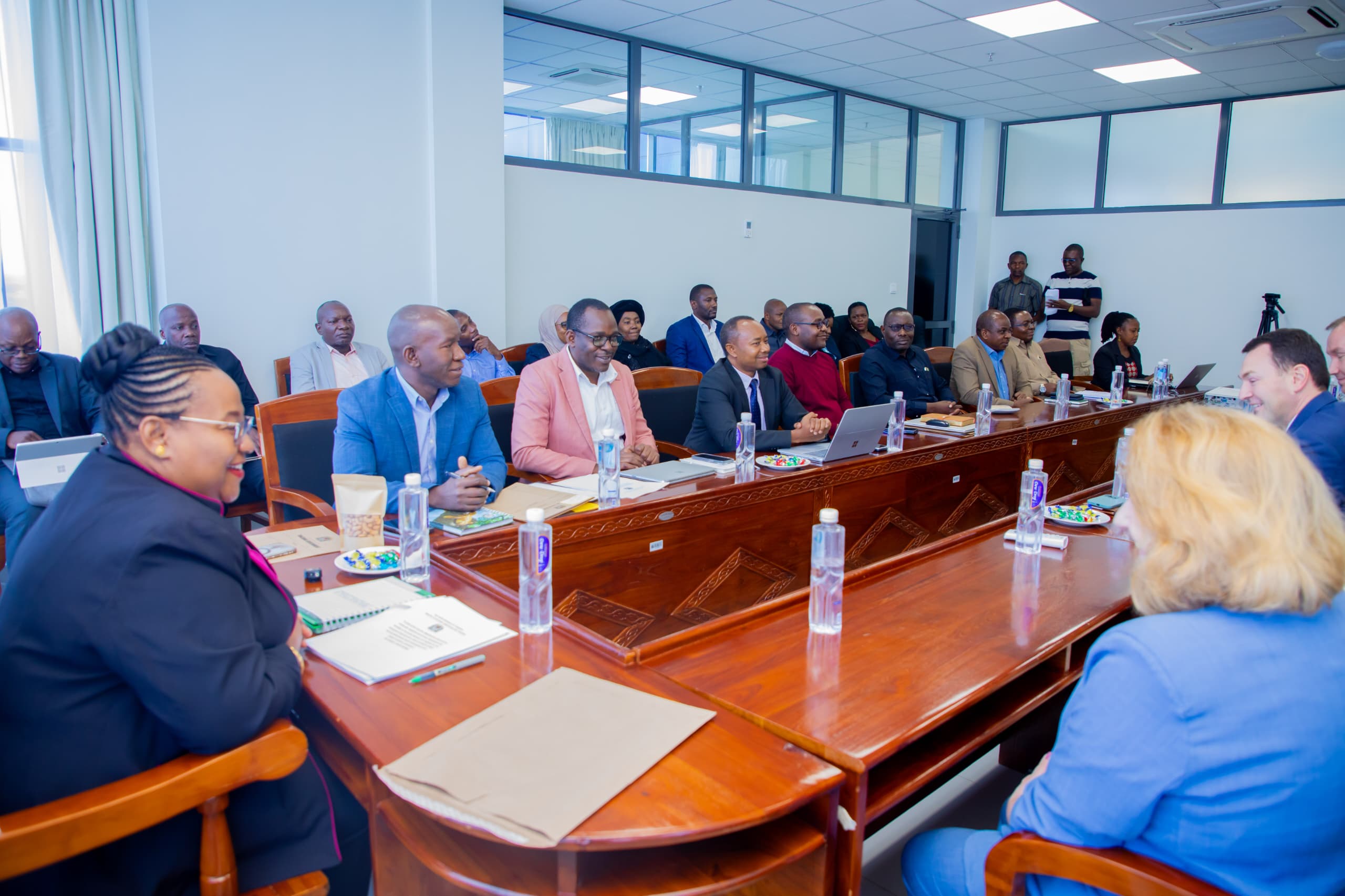 Dr Pindi Chana (L), Natural Resources and Tourism minister, speaks with a Russian delegate and heads of department during a meeting held at the ministry’s function hall in Dodoma yesterday. 