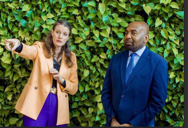 Minister of State in the Vice President's Office (Union and Environment), Hamad Yussuf Masauni, and the Deputy Director-General of the Global Green Growth Institute (GGGI), Helena McLeod look at something after the discussions held in Seoul, South Korea