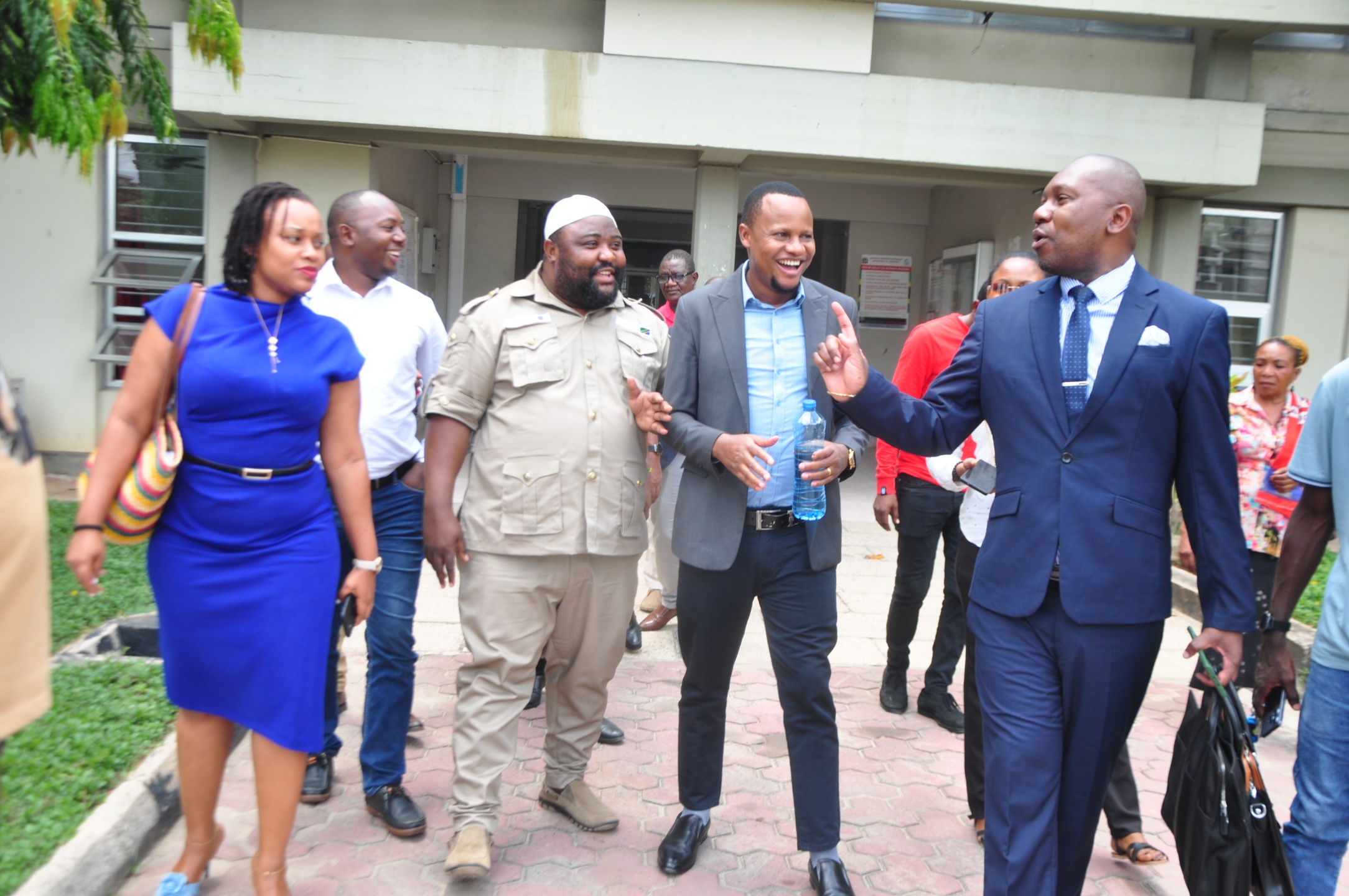 Opposition Chadema Coast Zone chairman Boniphace Jacob (3rd-L) and human rights activist Godlisten Malisa (2nd-R) leave the Kisutu Resident Magistrate’s Court in Dar es Salaam yesterday shortly after the adjournment of the hearing of their case. 