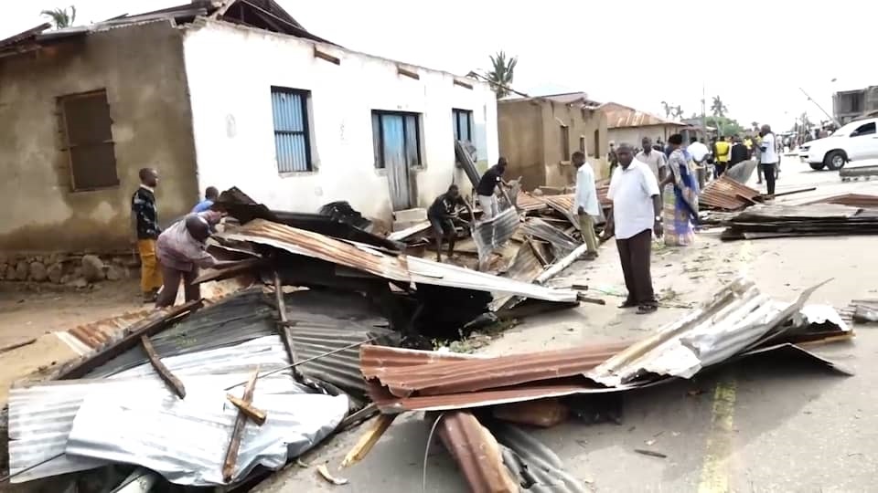 Musoma urban residents in Mara region collect their iron sheets after the roofing being blown off, the houses by heavy rain accompanied by strong winds in Musoma town, Mara region, on the night Sunday. 