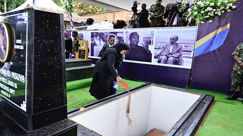 President Samia Suluhu Hassan takes her turn in the burial of former First Vice President and Prime Minister Cleopa Msuya at his Chomvu home village in Usangi, Mwanga District, yesterday.