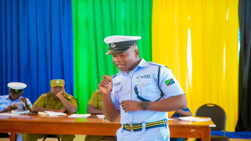 A traffic police officer pictured yesterday standing as a facilitator at road safety training for government and parastatal organisation drivers in Songwe Region. 