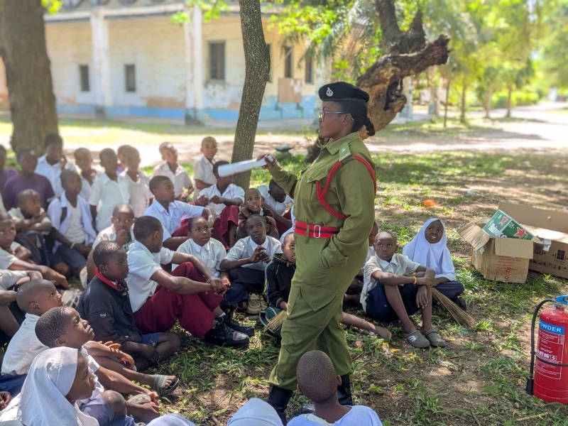   A Fire and Rescue Force officer conducts a fire firefighting sensitisation session for primary and secondary school students in Pangani District at the weekend. 