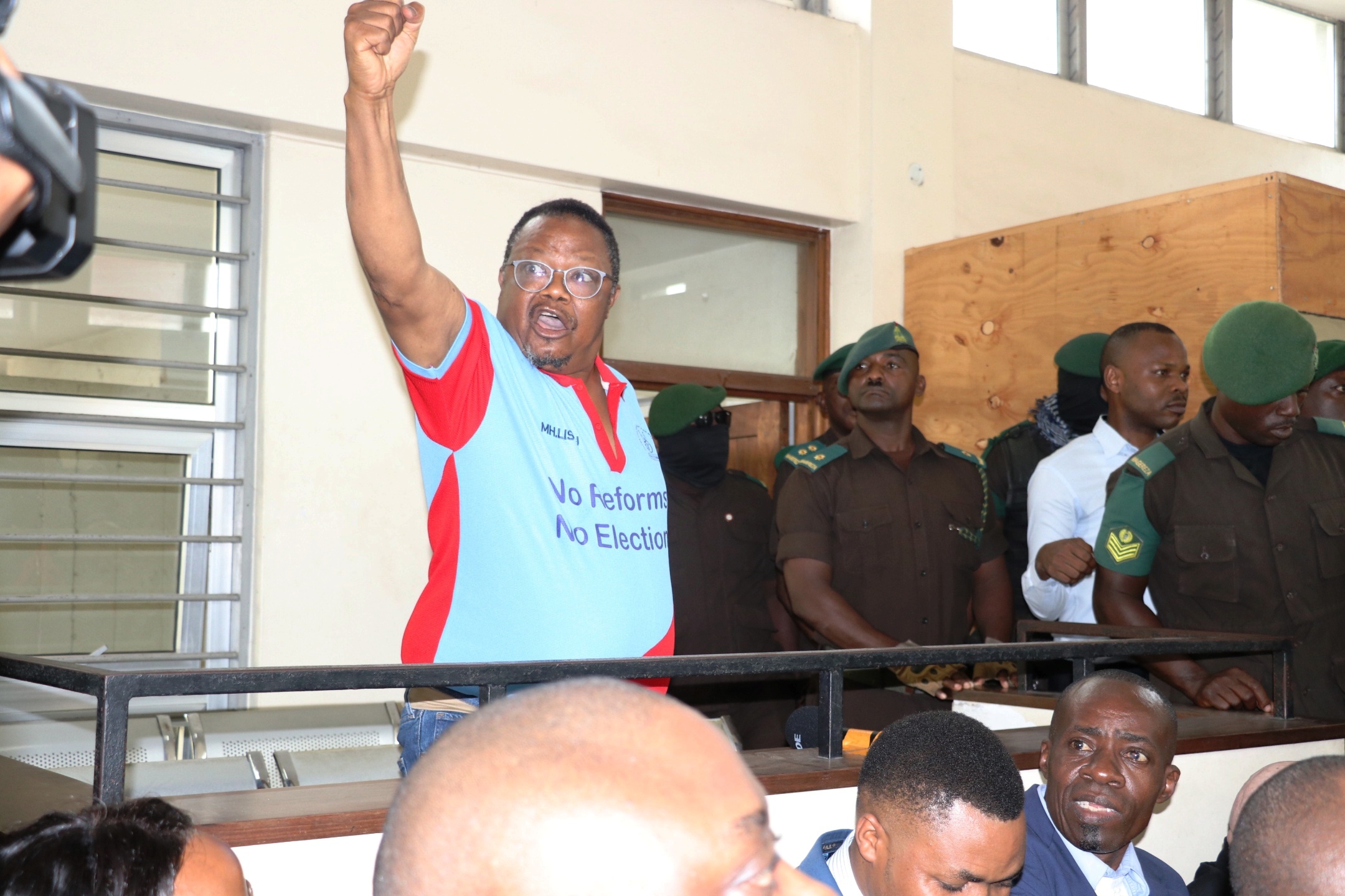 Tundu Lissu, embattled national Chairman of the opposition Chadema, defiantly chants the party’s slogan at the Kisutu Resident Magistrate’s Court in Dar es Salaam yesterday. 