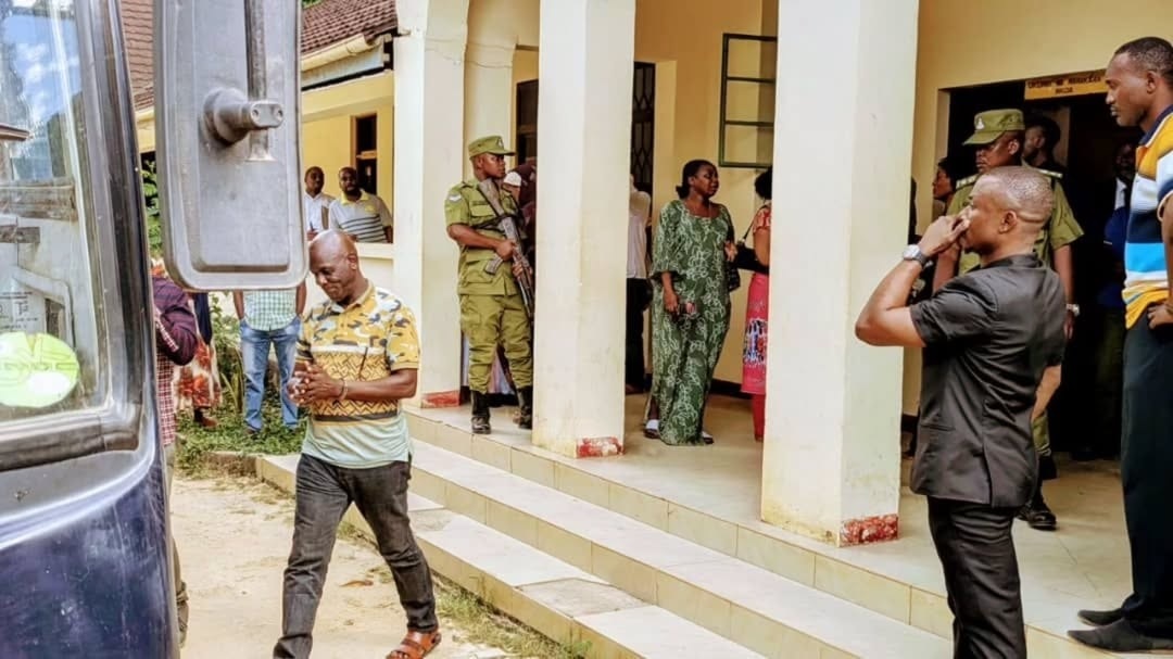 Left: One of two police officers sentenced to death by the Mtwara Zone of the High Court of Tanzania leaves the court yesterday shortly after   the verdict. They were found guilty of murdering a mineral dealer in 2022. 