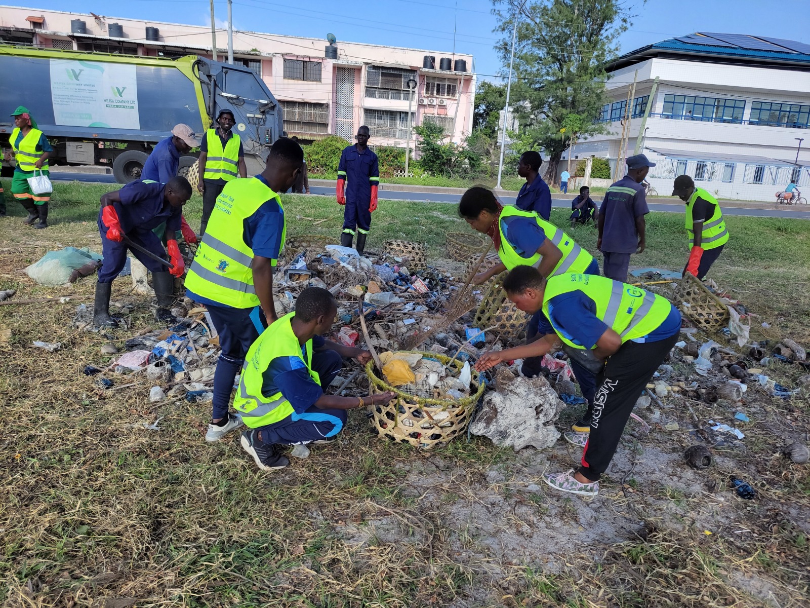  Members of university communities join representatives of various other agencies in an environmental clean-up drive along Dar es Salaam’s Dengu Beach on Saturday. 